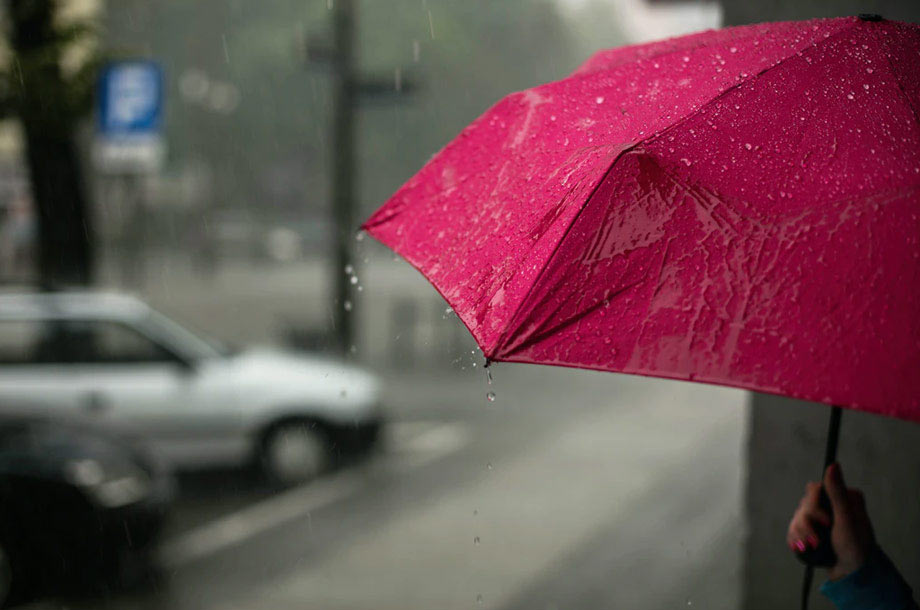 Red umbrella on rainy day | Umbrella Insurance